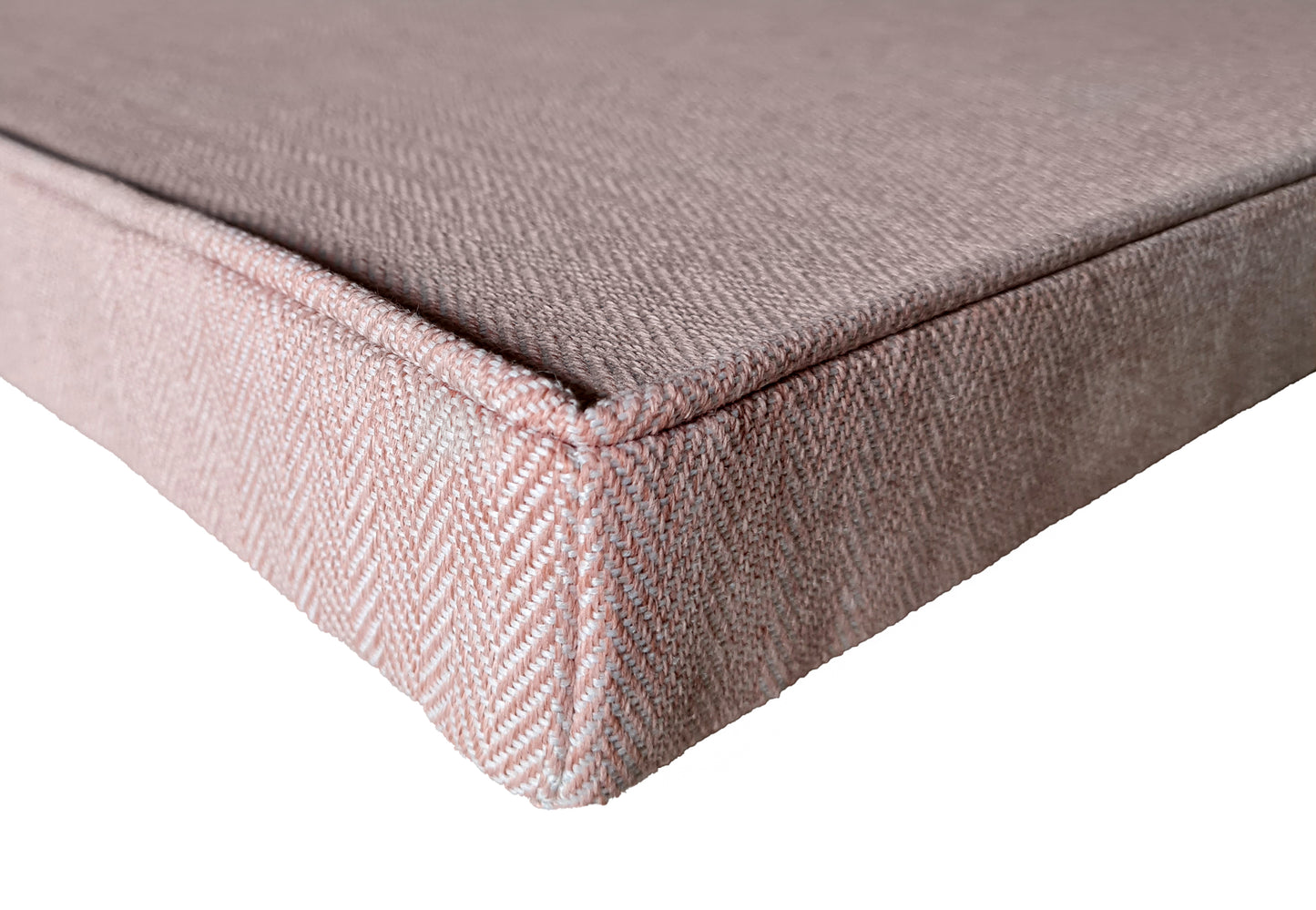 A light pink herringbone upholstery fabric bench cushion, wool look fabric bench cushion with a piped upper edge. The fabric is machine washable and can have a stain resistant finish. The box cushion has a zip at the back so the cover can be removed. Perfect for a kitchen banquette seating area or storage seat. The hardwearing pink fabric is perfect for use around kids, children and pets, kitchens and dining spaces. Corner dining seats, in built wooden benches, velcro straps and ties 