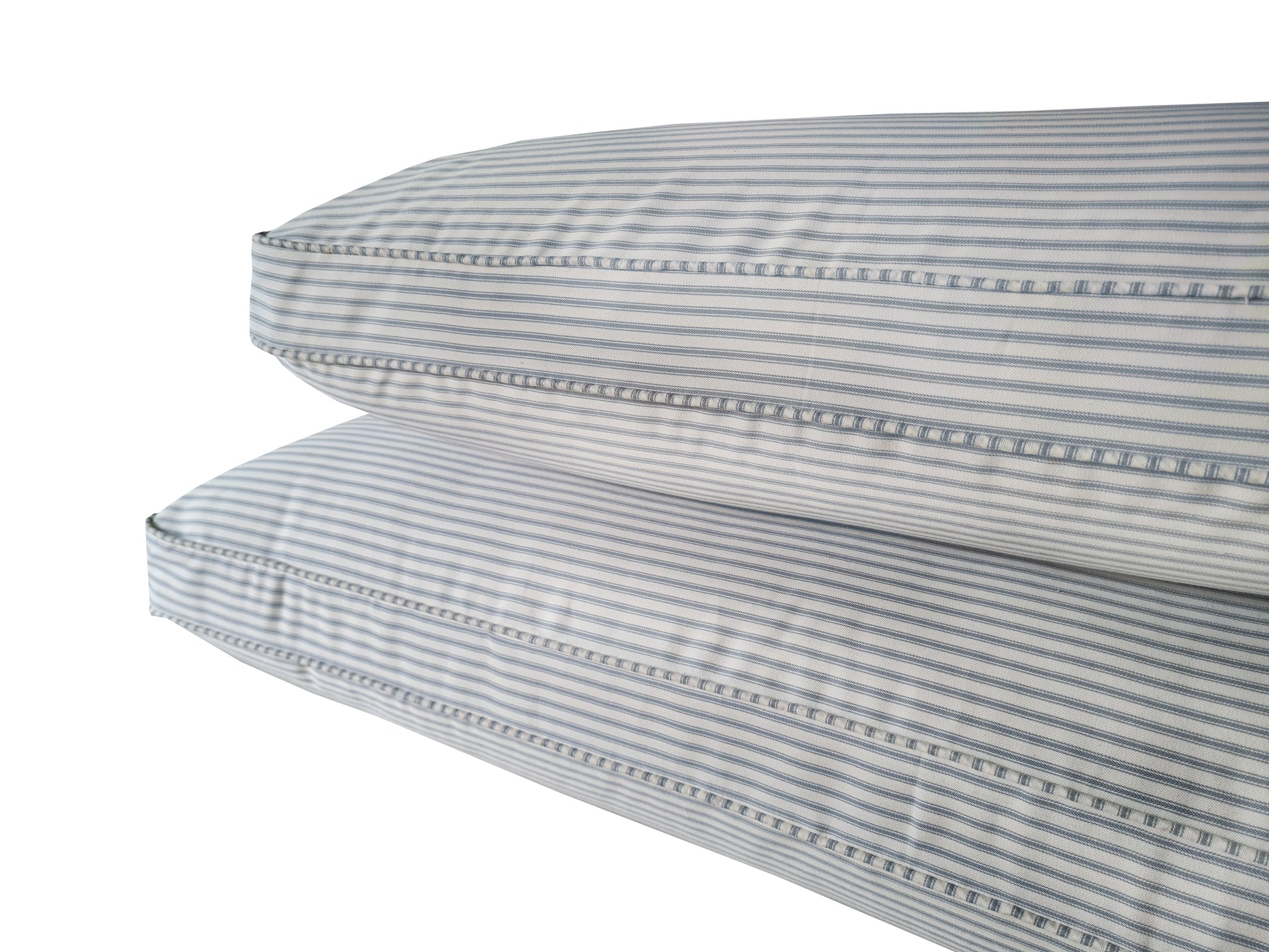 Two thick hollowfibre bench cushions made to measure with Ian Mankin cotton ticking fabric covers in off white and light blue stripes. French country chic cotton fabric bench cushions with thick, plump, comfortable sofa style filling. Recycled plastic bottle fibre filled banquette seating cushions. Thick back cushions for sofa style seating area. Sink in soft feather and foam cushion pads made to measure in yorkshire UK. Piped edge cotton ticking fabric seating cushions for rattan furniture