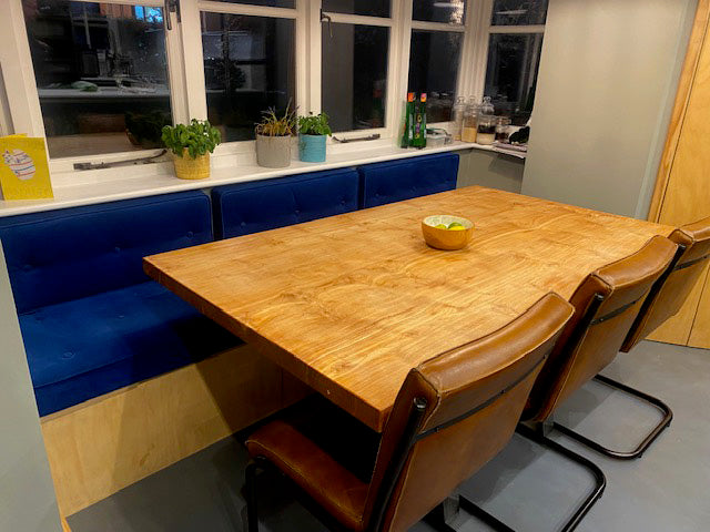 A bespoke set of indoor bench seating cushions made with Linwood Moleskin velvet fabric. Back cushions with heavy duty velcro strips to keep them attached to the wooden banquette seat. Button tufted by hand with dark blue velvet buttons. Piped seat cushions for a dining table bench seat. Hard wearing, wipe clean performance fabric bench cushions made to measure in luxury fabric. Wooden in built dining storage seat with lids. Firm foam with dacron inserts. Made in yorkshire uk. Machine washable. 